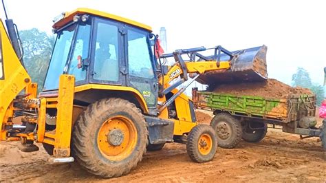 Jcb 3dx Backhoe Loader Machine Loading Red Mud In Mahindra 475 DI