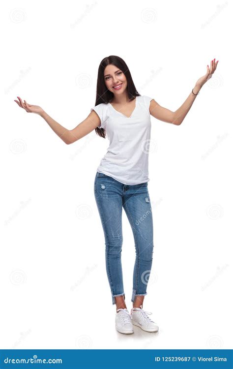 Casual Brunette Woman Standing And Raising Her Hands Stock Image