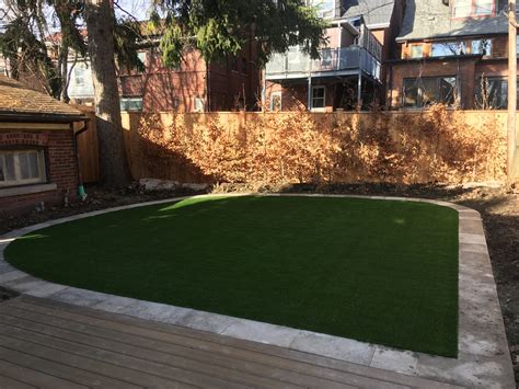 Flagstone Framing Around Grass Makes For Eye Catching Landscape Area