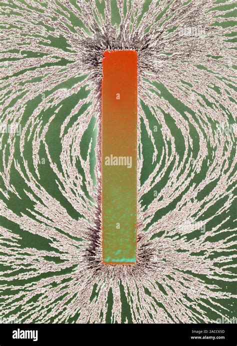 Magnetic Field Coloured Image Of Iron Filings Aligned Along The