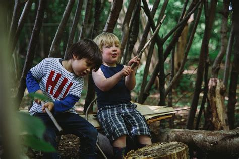 Children Den Building Playing In The Woods Reconnecting With Nature