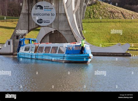 The Falkirk Wheel with trip boat coming out Stock Photo - Alamy