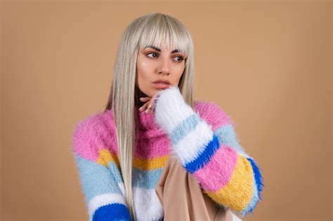 Premium Photo Blonde With Long Hair And Bangs With Nude Makeup And In A Multi Colored Bright