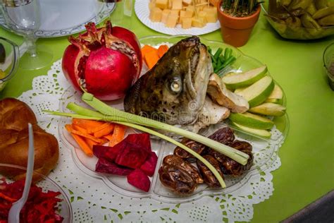 Rosh Hashanah Dish With The Fish Head Fruits And Vegetables Stock