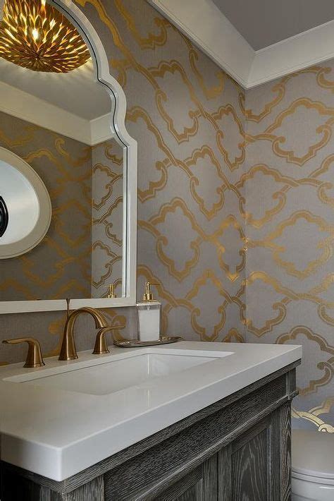 Gray And Gold Powder Room Boasts Walls Clad In Gray And Gold Wallpaper