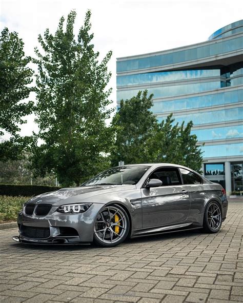 Silver Bmw Car Parked In Front Of Building