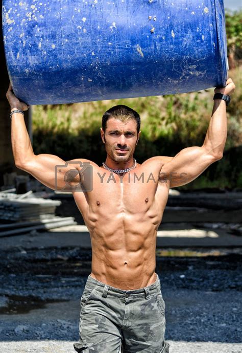 Hot Muscular Construction Worker Shirtless Carrying Barrel By Artofphoto Vectors