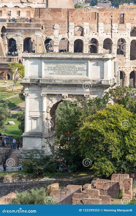 Ancient Arch of Titus on the Roman Forum Against Colosseum, Rome ...