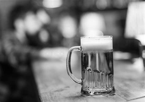 Glass With Beer On Bar Counter Table Visitor On Background Defocused Glass With Fresh Lager