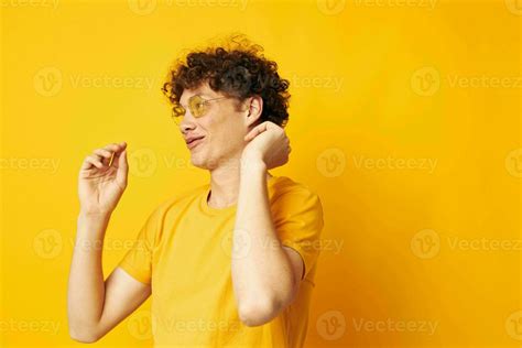 Young Curly Haired Man Yellow T Shirt Glasses Fashion Hand Gestures