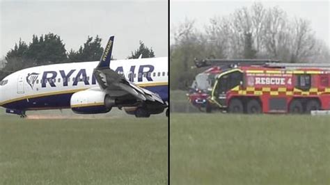 Sparks fly from Ryanair plane after its nose wheel collapsed while landing