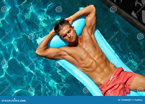 Summer Man Body Care Beautiful Male Relaxing In Pool Stock Image