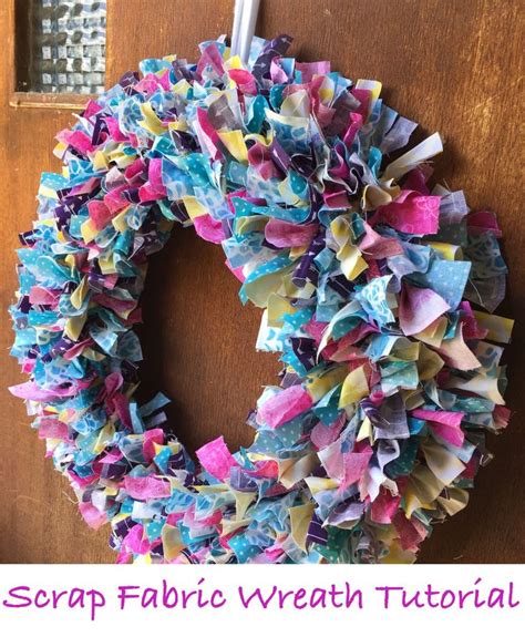 A Colorful Wreath Hanging On The Front Door With Paper Streamers All Over It S Sides