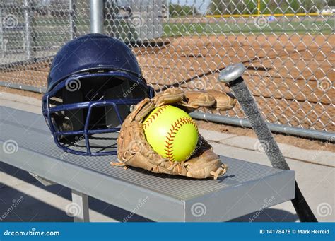 Yellow Softball, Helmet, Bat, and Glove Stock Photo - Image of field ...