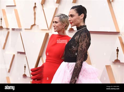 Kristen Wiig, left, and Gal Gadot arrive at the Oscars on Sunday, Feb ...