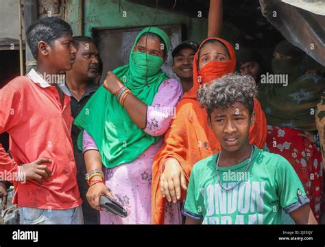 Local Residents Stand Inside A House After A Bulldozer Demolished An