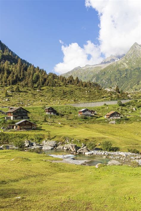 Small Mountain Village Nestled In The Green Swiss Mountains Stock Photo