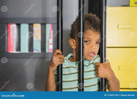 Kid Prisoner Try To Escape from Jail. Stock Photo - Image of childhood ...