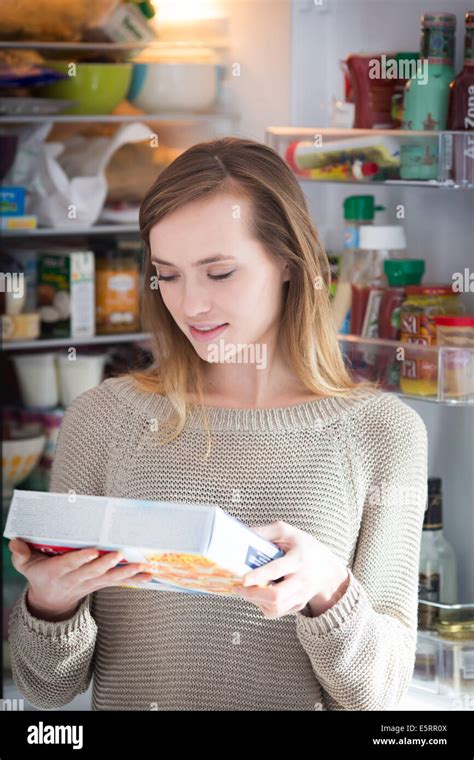 Woman Checking The Composition And Nutrition Facts Stock Photo Alamy