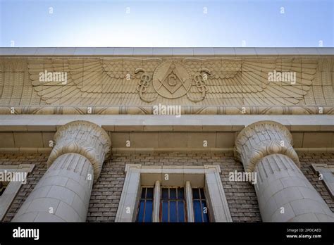 Looking up at Masonic symbols on the exterior of a Masonic temple Stock ...