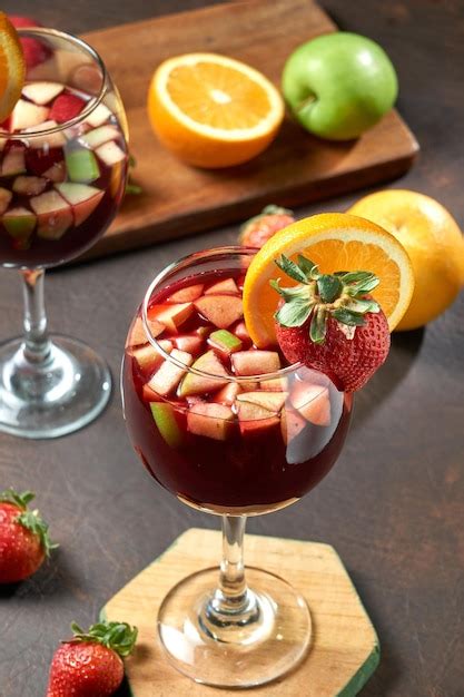 Premium Photo Glass Of Sangria With Orange And Strawberry Decoration