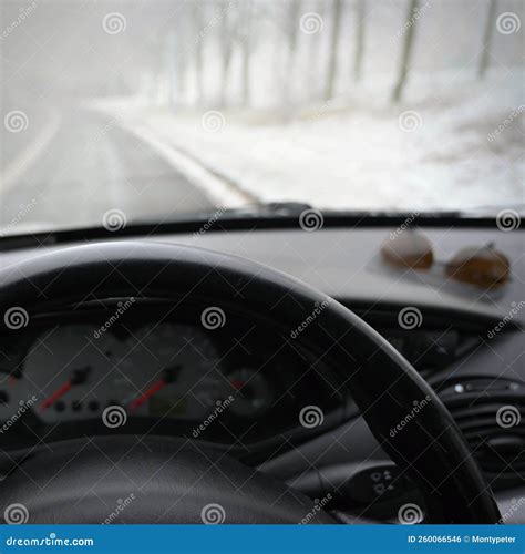 Dangerous Winter Season with Snow on the Road. the Interior of the Car