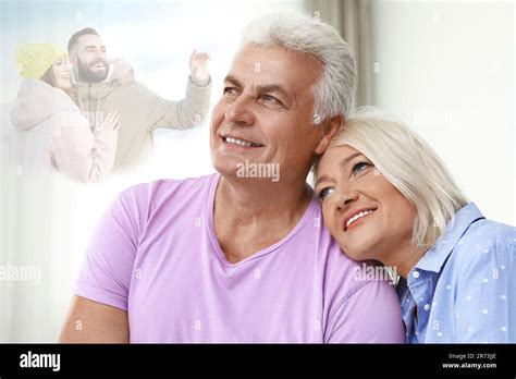 Happy Senior Couple Remembering Old Times Translucent Picture Of Young