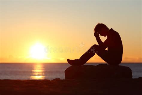 Sad Man Silhouette Worried On The Beach Stock Photo - Image: 51640055