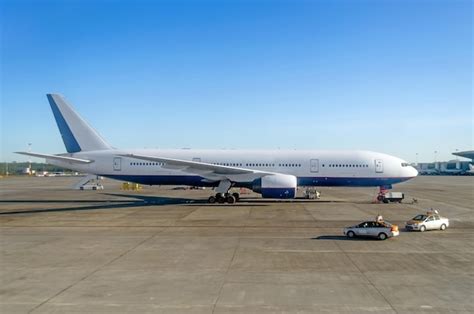 Premium Photo Aircraft Side View Parking At The Airport