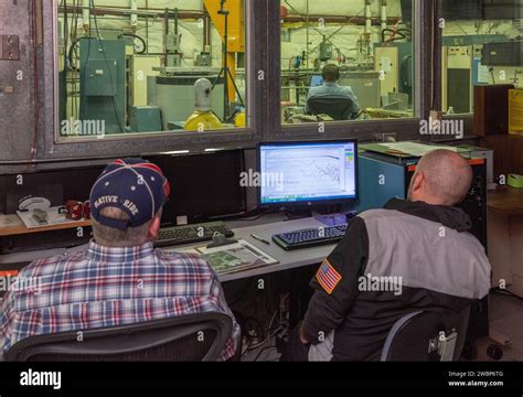 Engineers Monitor Data During Vibration Testing Of A Cruise Motor