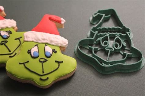 A Grinch Cookie Cutter And Cookies Grinch Cookies Grinch Cookie