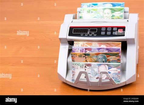 Barbadian dollar in a counting machine Stock Photo - Alamy