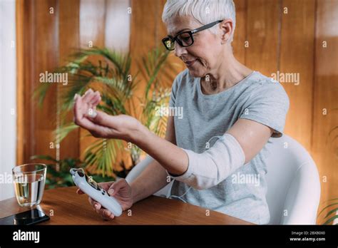 Senior Woman Doing Elbow Physical Therapy With Tens Stock Photo Alamy