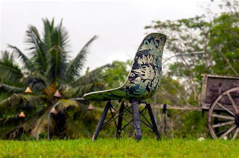 Premium Photo A Painted Garden Chair In The Park