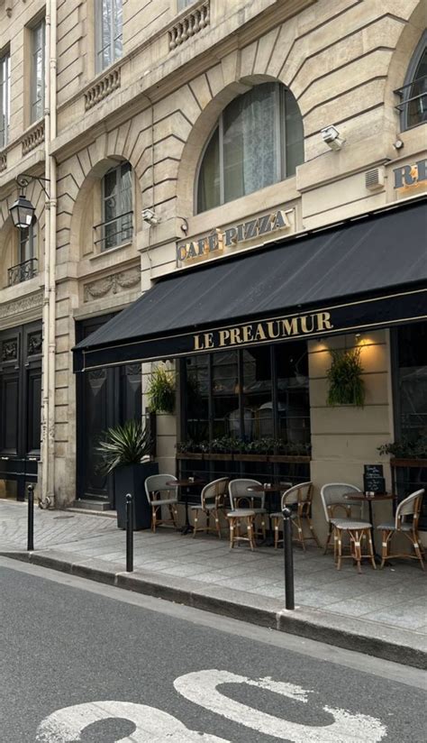 The Outside Of A Restaurant With Tables And Chairs On The Sidewalk In