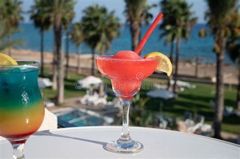 Colourful Cold Strawberry Daiquiri And Rainbow Paradise Cocktails