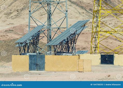 Solar Panels Near A Telecommunication Tower In The Mountains Of Egypt