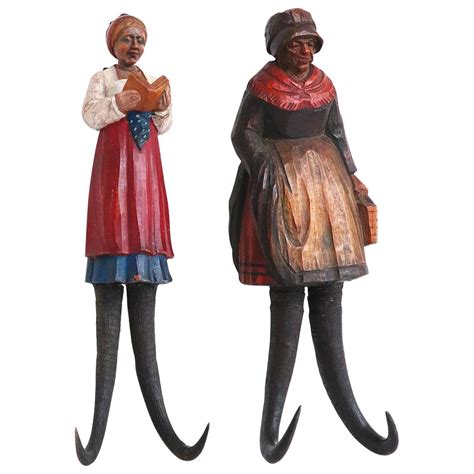 Pair Of Black Forest Figural Carved Wall Hooks Th Century For Sale