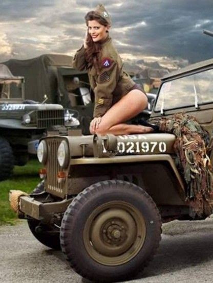 A Woman Sitting On Top Of An Army Jeep