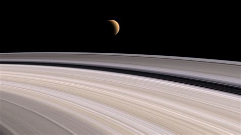 Remarkable Nasa Images Reveal How A Moon Makes Saturn S Rings Wave