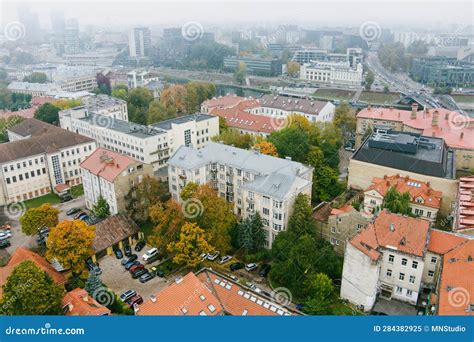 Beautiful Foggy Vilnius City Scene In Autumn With Orange And Yellow