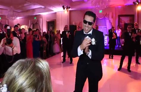 Groomsmen perform wedding dance surprise for the bride.