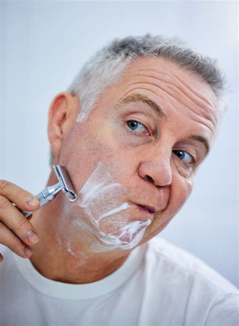 I Have To Concentrate When Shaving Shot Of A Mature Man Shaving His
