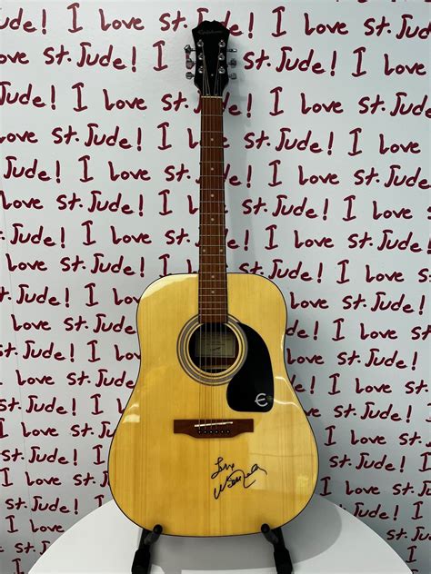 Charitybuzz Willie Nelson Autographed Acoustic Guitar