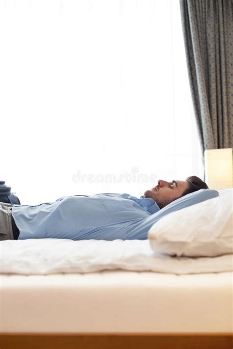 Man Sleeping In Bed Side View