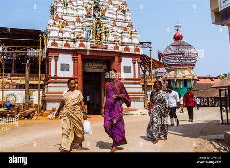 Udupi Karnataka India Women Walk Past The Gopuram Tower Of The 13th