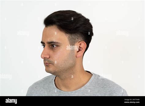 Portrait Of A Brown Skinned Man With Silky Well Groomed Black Hair On