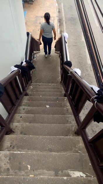 Premium Photo Rear View Of Woman Walking On Stairs