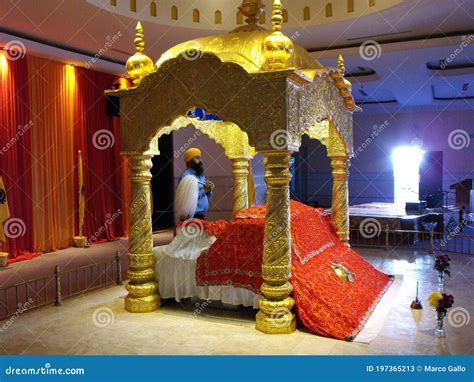 A Sikh Prays at the Altar with the Holy Book in the Main Prayer Hall of ...