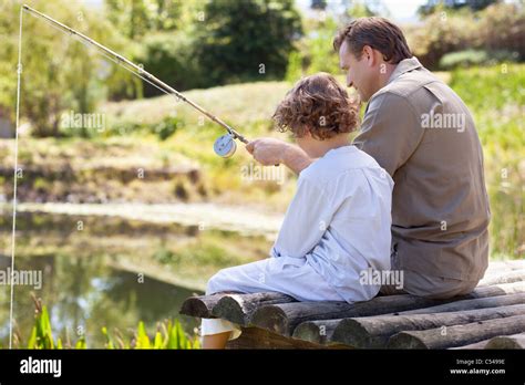 Mature Father And Son Sitting Fishing Hi Res Stock Photography And Images Alamy